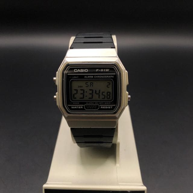  CASIO JVI fW^ rv F-91W  uh 