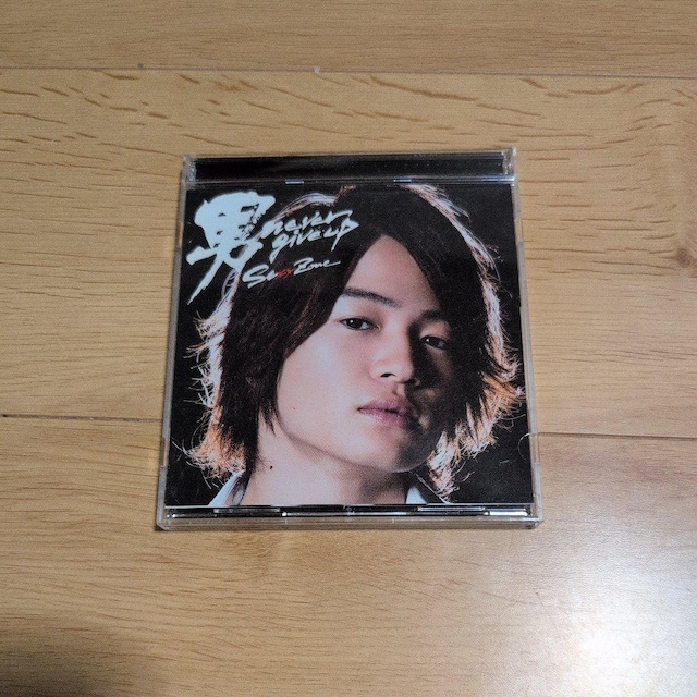 j never give up   CD/DVD/rfI 