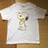 カウズ×ピーナッツ・スヌーピーイラスト柄Tシャツ。XLホワイト
